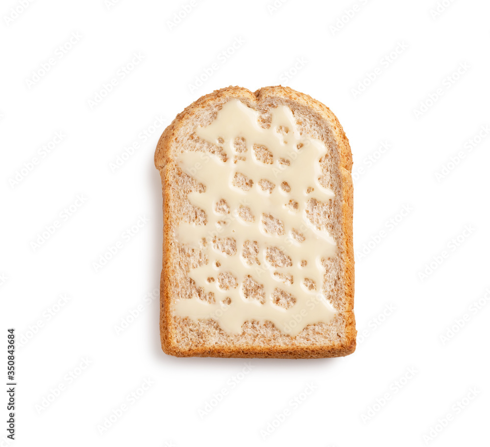 slice whole grain bread with sweetened condensed milk on white background slice whole grain bread with sweetened condensed milk on white background