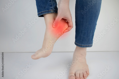 Fototapet Woman suffering from heel pain