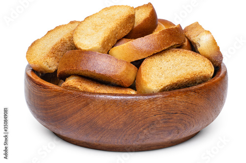 Photos A heap of mini rusks in wooden bowl