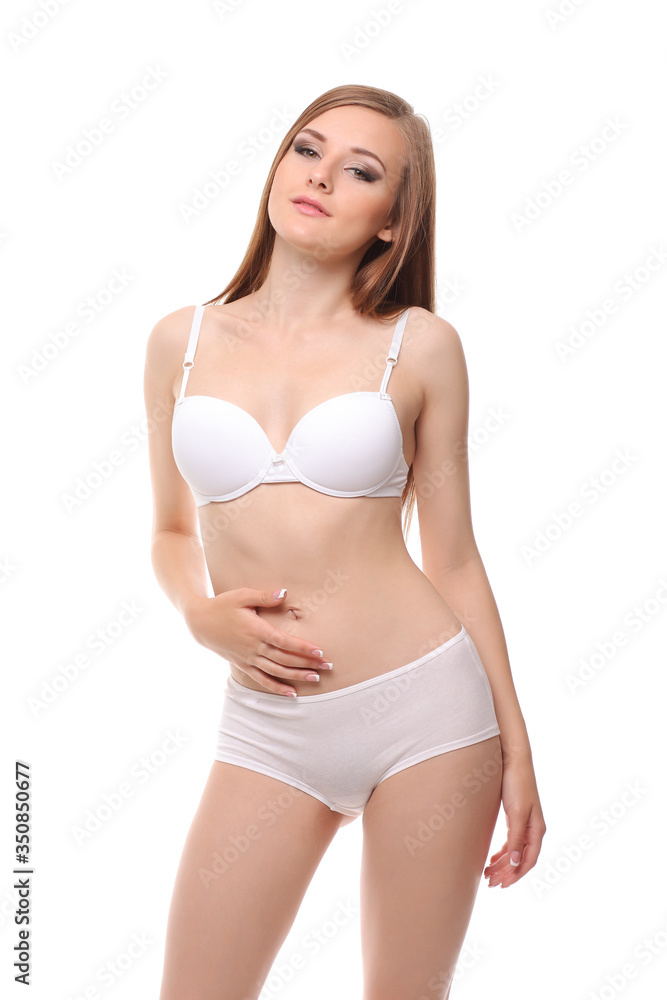 Fototapeta premium woman with a slim figure in white lingerie