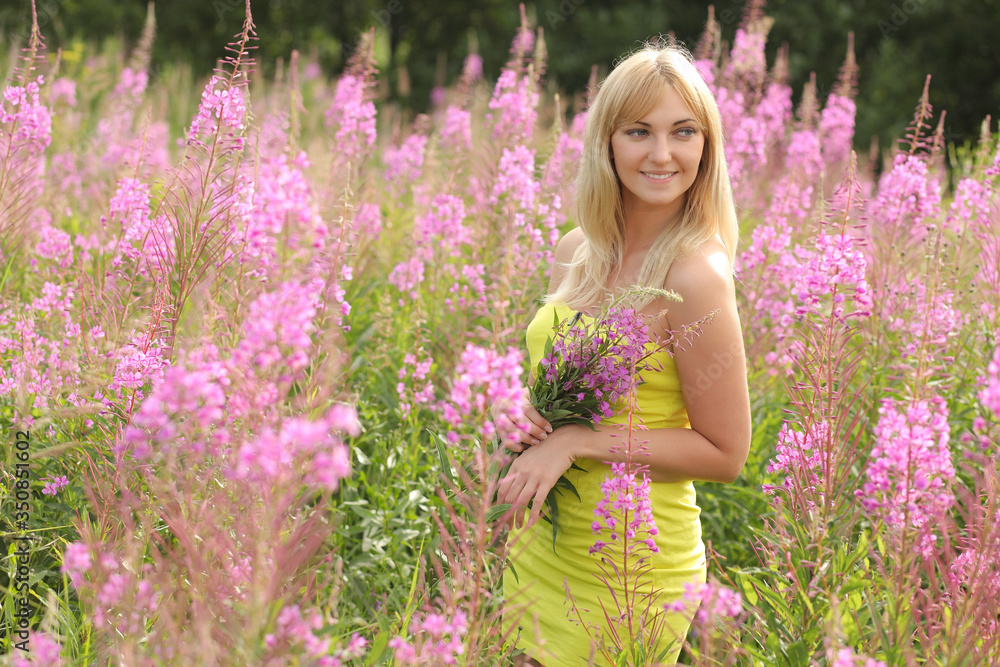 Young beautiful smiling woman outdoors Young beautiful smiling woman outdoors