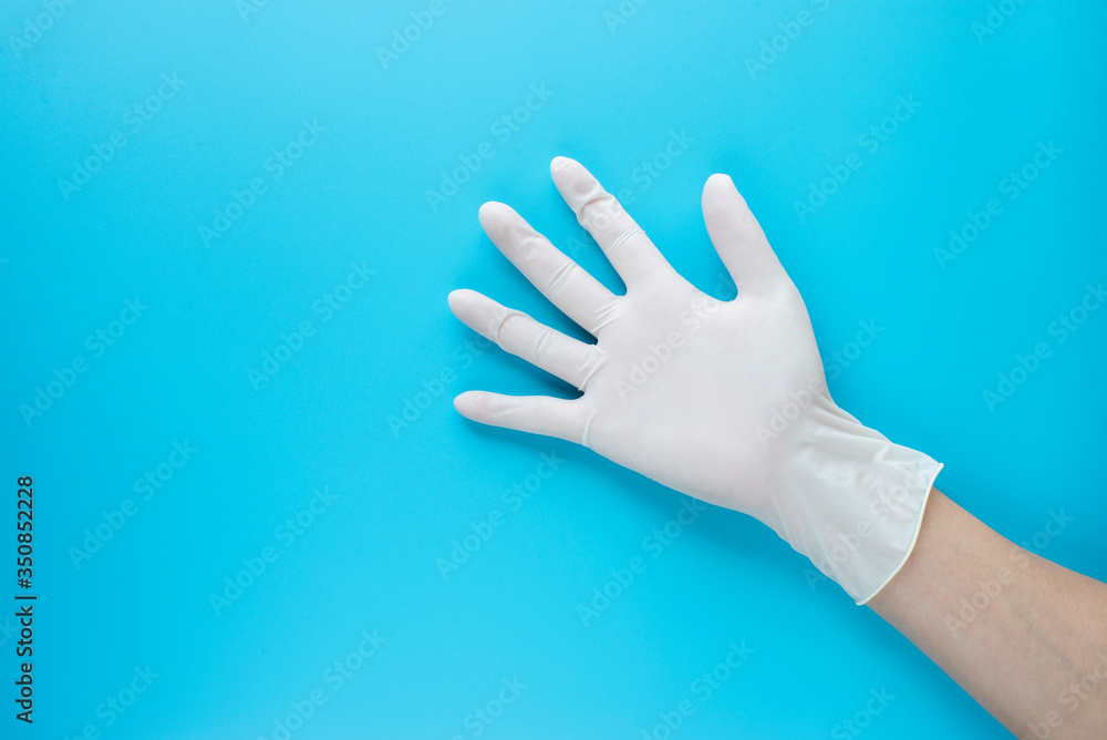 hand shape with gloves on blue background