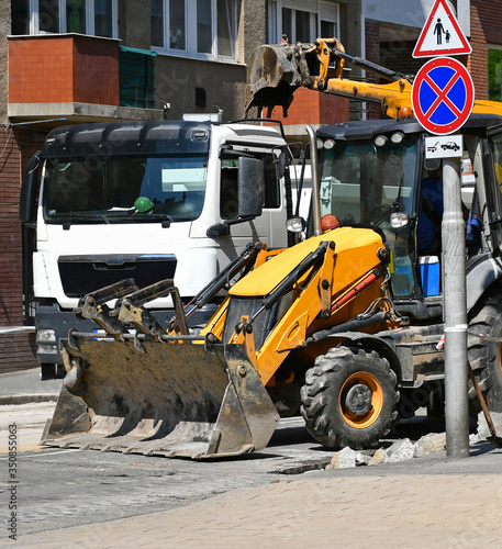 Excavator stands at the road construction