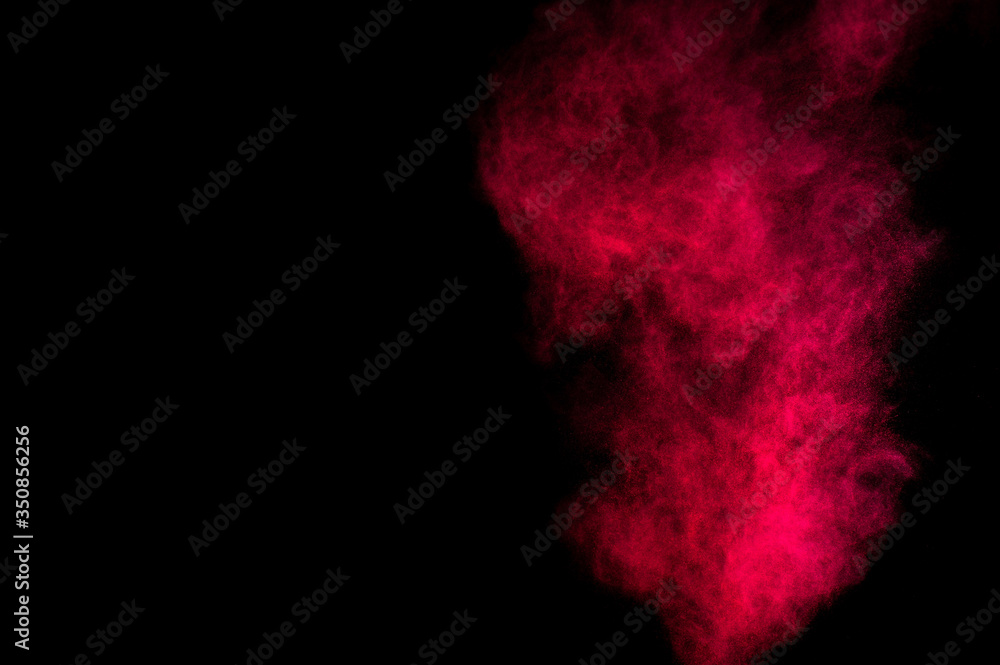 Red and pink powder explosion on black background. Colored powder cloud. Colorful dust explode. Paint Holi. Red and pink powder explosion on black background. Colored powder cloud. Colorful dust explode. Paint Holi.