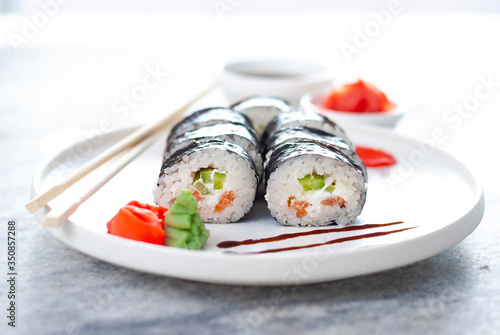 Sushi Rolls asian food stylish beautiful close up picture. Tasty delishes meals with rice and seafood on the white plate