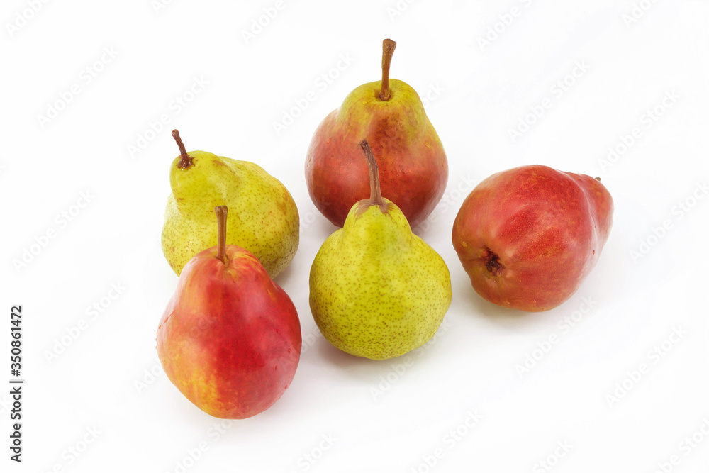 On a white background in the center are fresh ripe fruit in the amount of five pieces. Red and green pears On a white background in the center are fresh ripe fruit in the amount of five pieces. Red and green pears
