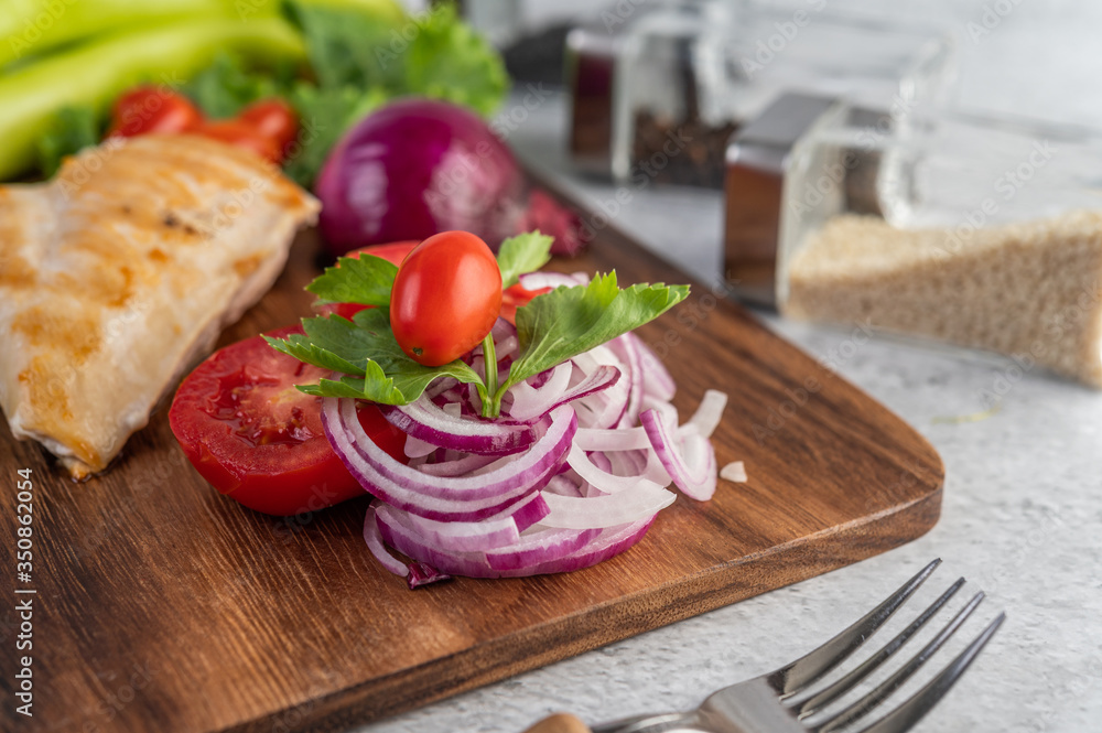 Chicken steak placed on a wooden tray. Chicken steak placed on a wooden tray.