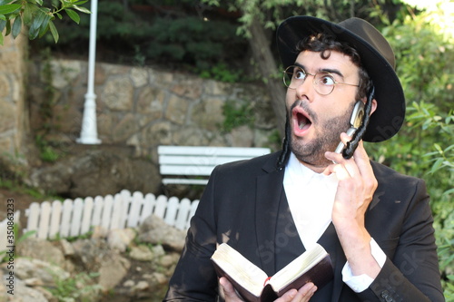 Photography Jewish man getting shocking news on the phone