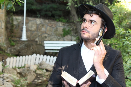 Jewish man getting shocking news on the phone 