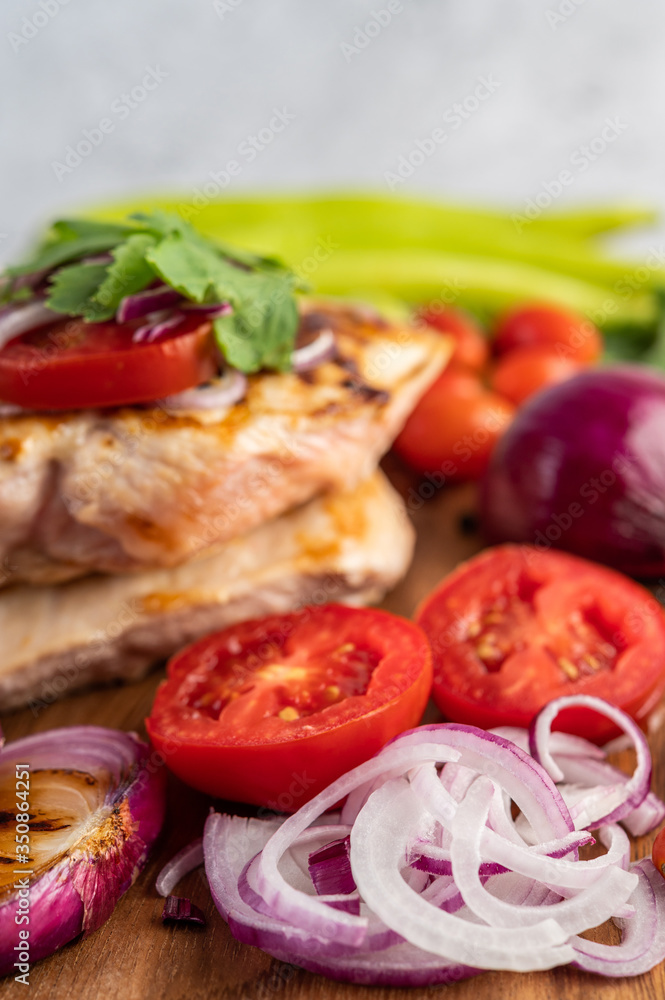 Chicken steak placed on a wooden tray. Chicken steak placed on a wooden tray.