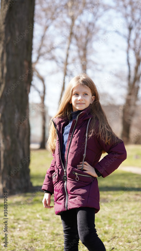 Portrait of pretty girl with long hair in spring in park Portrait of pretty girl with long hair in spring in park