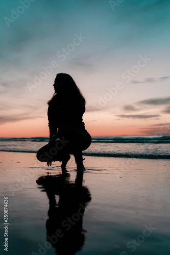 girl on the beach at sunset