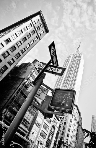 Fényképezés Low Angle View Of One Way Sign Against Empire State Building