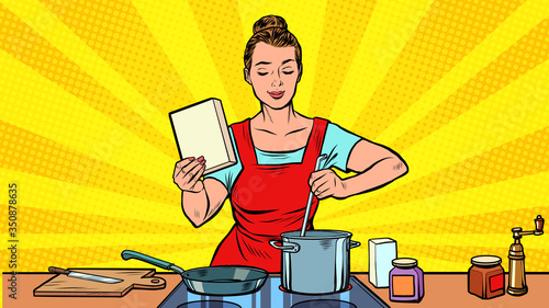A woman cooks in the kitchen