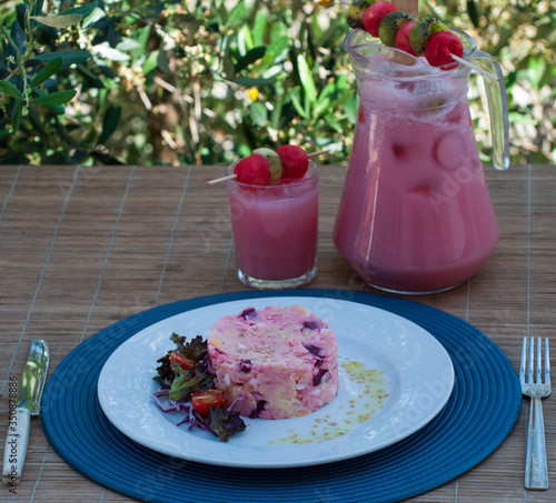 potato, egg and beet salad. accompanied by watermelon juice