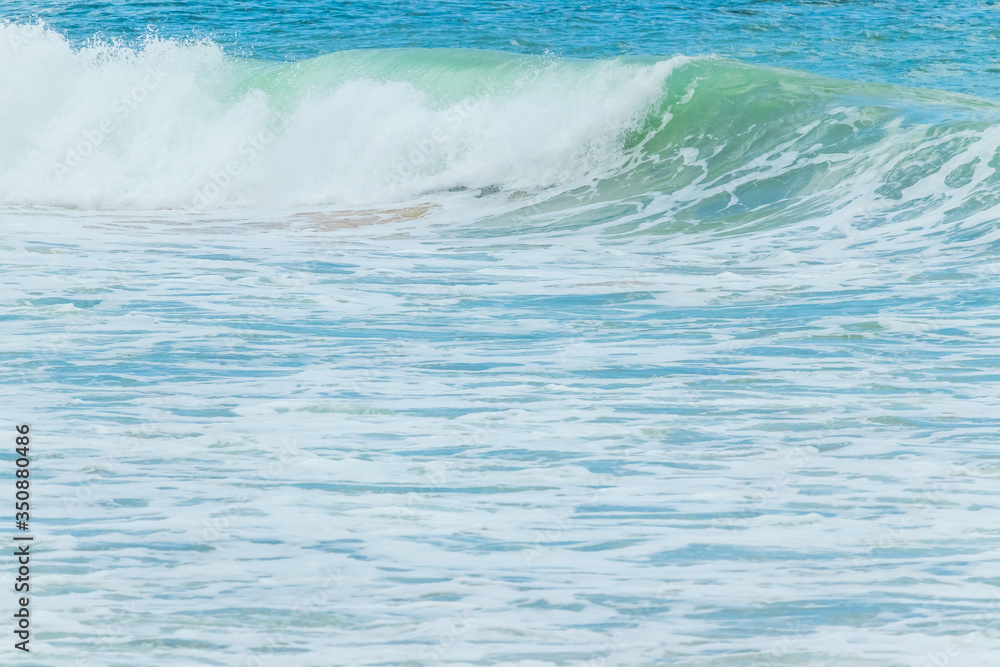 Fototapeta premium sea wave with white foam on serface