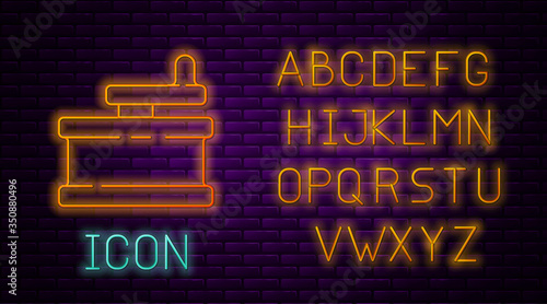 Glowing neon line Manual grinder icon isolated on brick wall background. Neon light alphabet. Vector Illustration