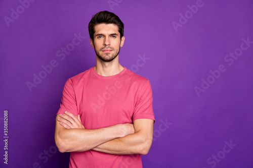 Photo of macho guy serious perfect appearance neat hairdo bristle young chief boss arms crossed not smiling wear casual pink t-shirt isolated purple color background