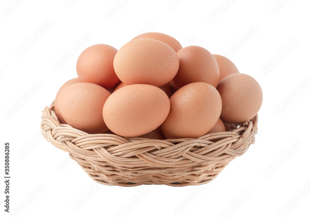 Raw eggs in the wicker basket isolated Raw eggs in the wicker basket isolated
