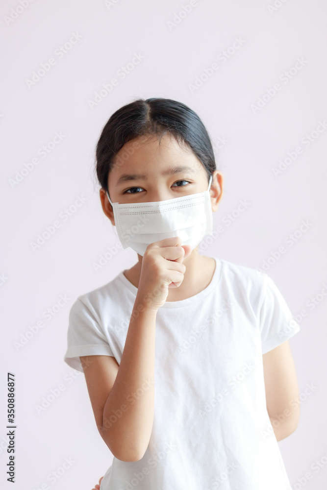 Portrait of Asian little girl wears a sanitary mask and cough