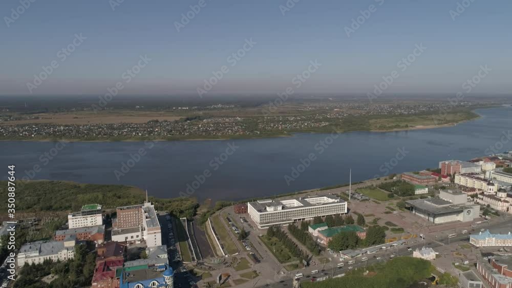 06. Aerial view of Tomsk city with lots of trees and Tom river. Administration building of Tomsk region. The city has tall and low houses and buildings. Summer sunny day. Russia, Tomsk city
06. Aerial view of Tomsk city with lots of trees and Tom river. Administration building of Tomsk region. The city has tall and low houses and buildings. Summer sunny day. Russia, Tomsk city