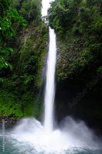 Long exposure of a large waterfall located in the center of an Amazon jungle © Javier
