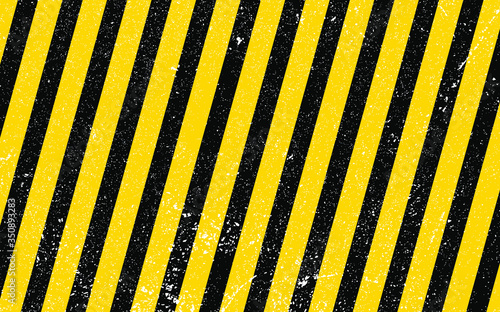 Vector illustration of grunge under construction background. Characteristic black and yellow diagonal stripes pattern without any text. Ink texture with splatter and blots effects.