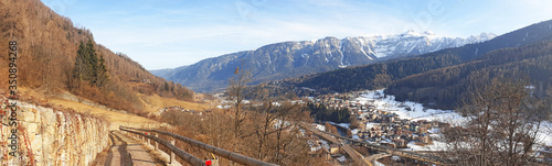 Panorama of a small town at the foot of the Dolomites mountains.