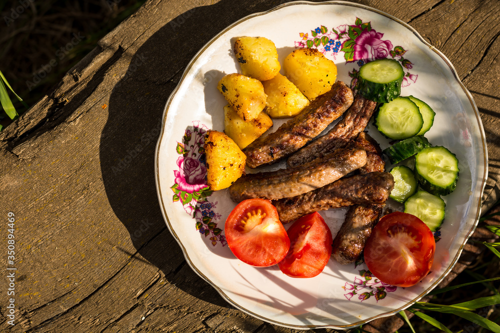 grilled meat with vegetables on a wooden table grilled meat with vegetables on a wooden table