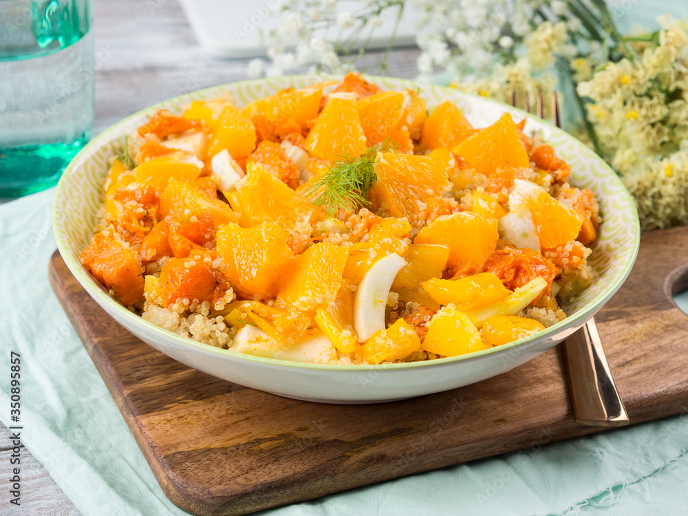Fresh summer vegan quinoa bowl salad with baked spiced pumpkin, fennel, oranges and turmeric. Healthy gluten free lunch or dinner Fresh summer vegan quinoa bowl salad with baked spiced pumpkin, fennel, oranges and turmeric. Healthy gluten free lunch or dinner