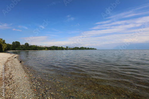 A Leman lake beach with Lausanne in background