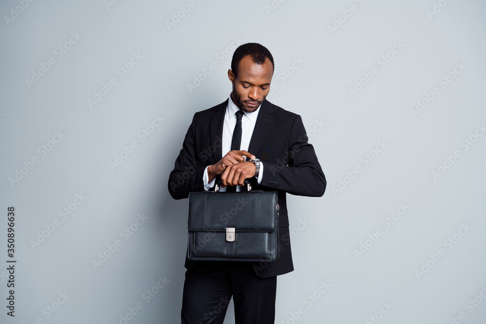 Portrait of his he nice attractive rich wealthy imposing guy hr recruiter agent broker banker financier going waiting looking at timer isolated over grey pastel color background Portrait of his he nice attractive rich wealthy imposing guy hr recruiter agent broker banker financier going waiting looking at timer isolated over grey pastel color background