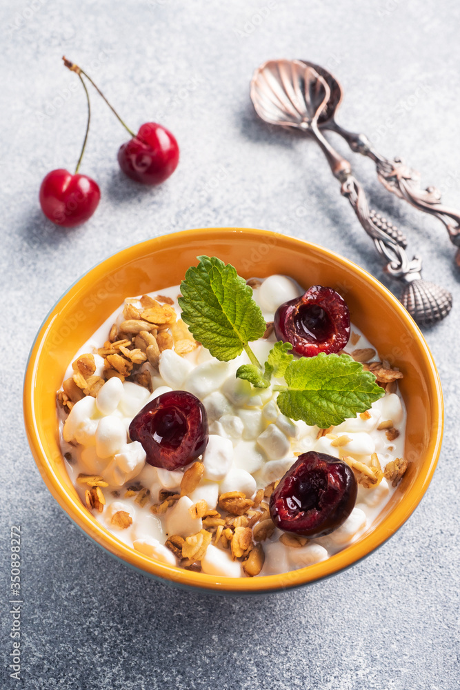Grain curd muesli with fresh cherries on a plate. Concept healthy Breakfast with cottage cheese and berries. Copy space Grain curd muesli with fresh cherries on a plate. Concept healthy Breakfast with cottage cheese and berries. Copy space