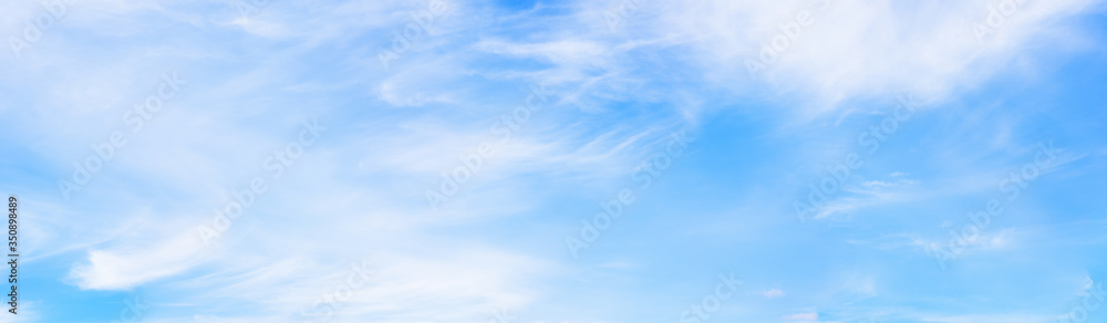 Panorama of blue sky with white soft clouds.