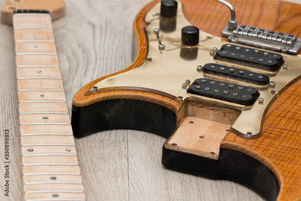 Electric guitar repair. Neck removed from body for refinishing Stock