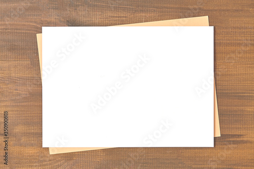 Blank of brochure is on a wooden desk. Template for your design.