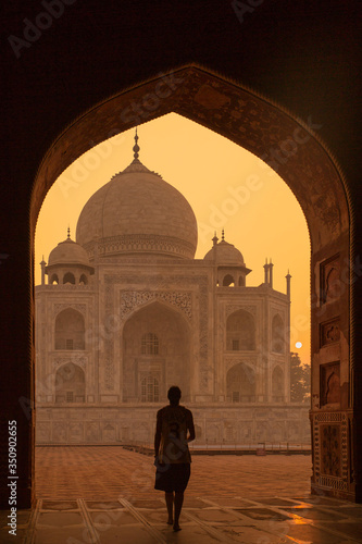 A sun rises over Agra