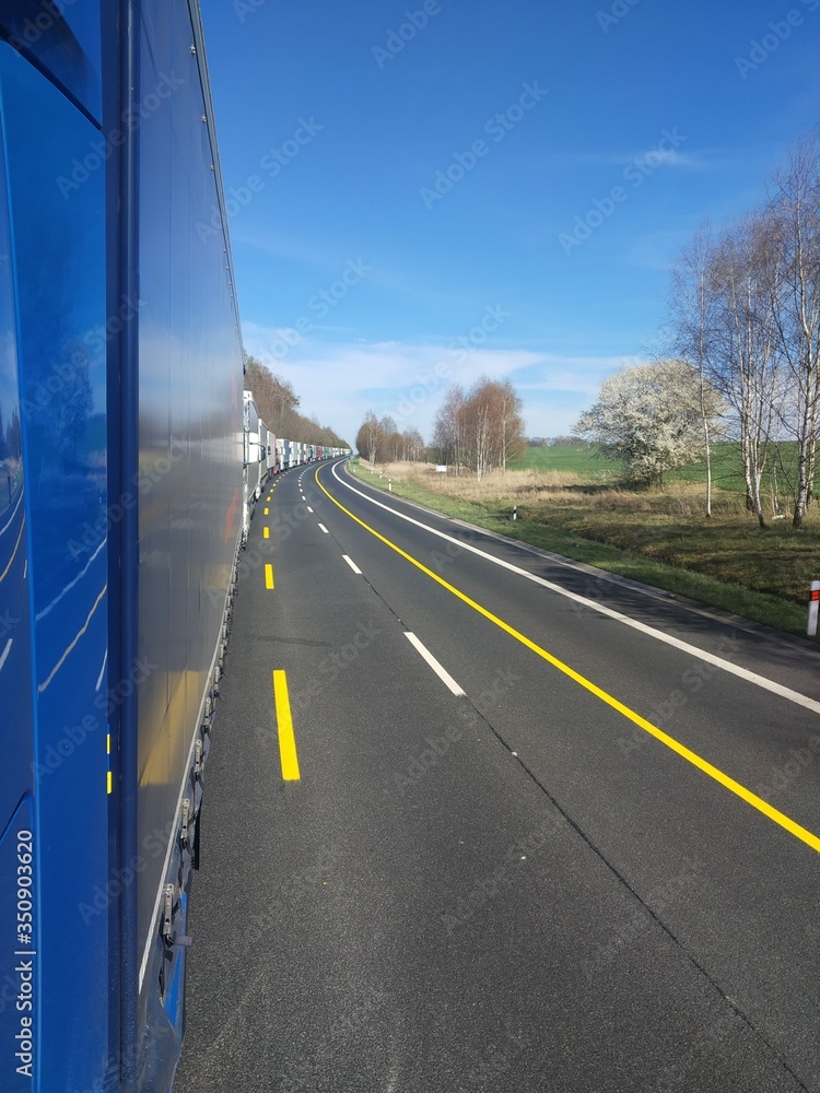 A convoy of trucks at the borders of the states of the European Union. Traffic jam during the coronavirus.An endless line of trucks. They are waiting to cross the border. A convoy of trucks at the borders of the states of the European Union. Traffic jam during the coronavirus.An endless line of trucks. They are waiting to cross the border.