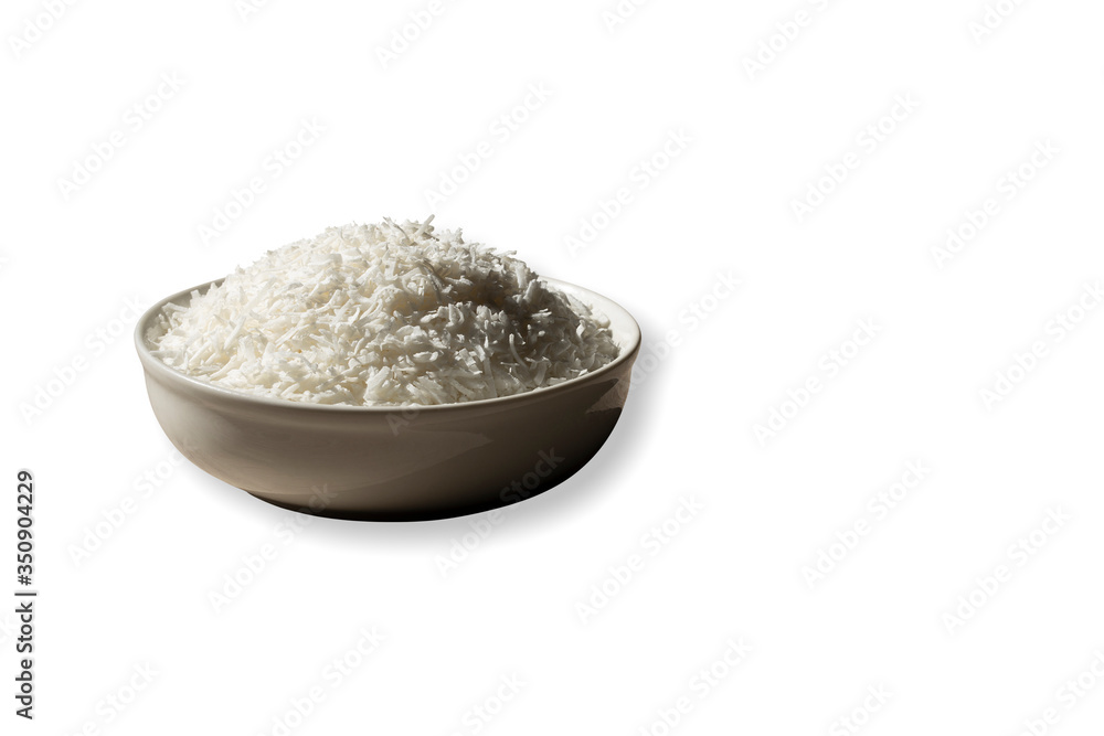 Fresh grated raw coconut tropical fruit placing in white bow with clipping path isolated dropped shadow white background Fresh grated raw coconut tropical fruit placing in white bow with clipping path isolated dropped shadow white background