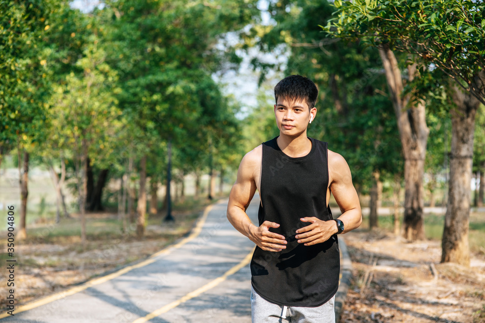 Men and women exercise by running on the road. Men and women exercise by running on the road.