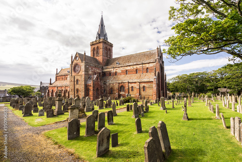 St Magnus Cathedral and surrounding gothic graveyard in Kirkwall, Orkney Islands, Scotland. The holy red sandstone architecture is part of the church of Scotland
