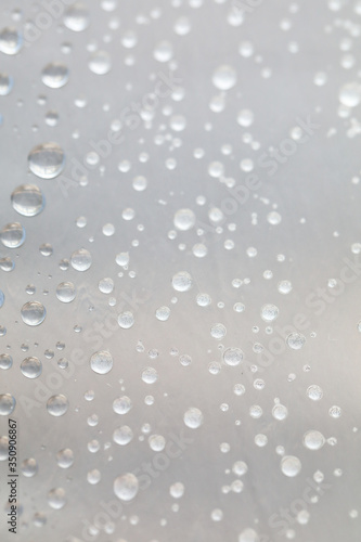 Background design made of water drops on a gray background 