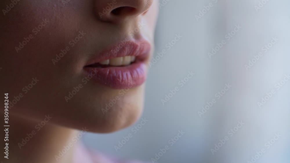 Woman applying lipstick. Young model putting on some makeup, using lipstick to color hel lips - beauty concept closeup. chubby lips are painted on a young girl. makeup from a makeup artist. Woman applying lipstick. Young model putting on some makeup, using lipstick to color hel lips - beauty concept closeup. chubby lips are painted on a young girl. makeup from a makeup artist.