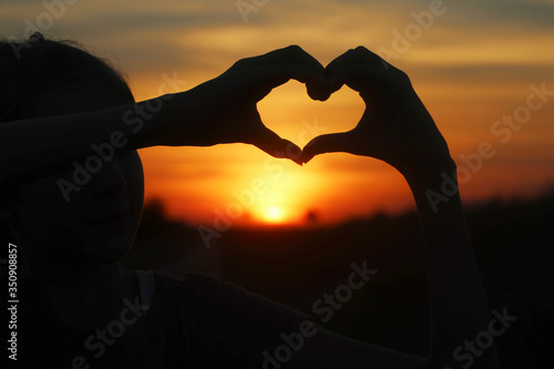 Hands signing a heart shape