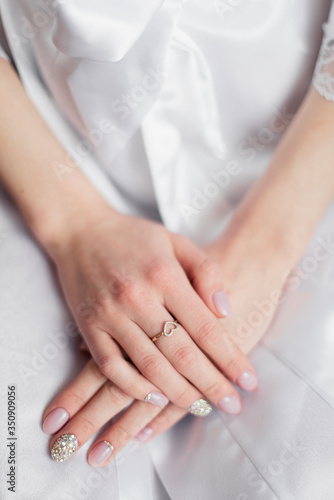 The morning of the bride. The wedding ring on the bride's hand. 