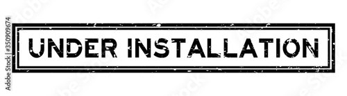 Grunge black under installation word square rubber seal stamp on white background