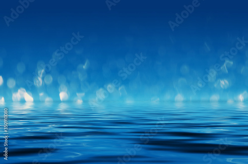 Dark abstract background with bokeh. Reflection in the water of bright blurry lights. Smoke, fog.