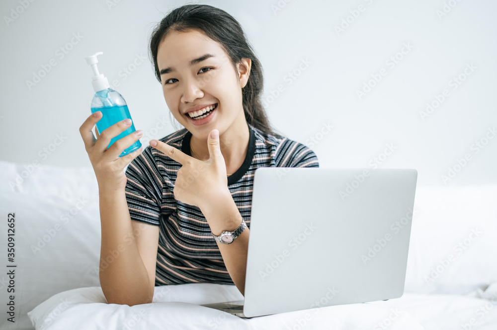 Women hold gel to wash hands.