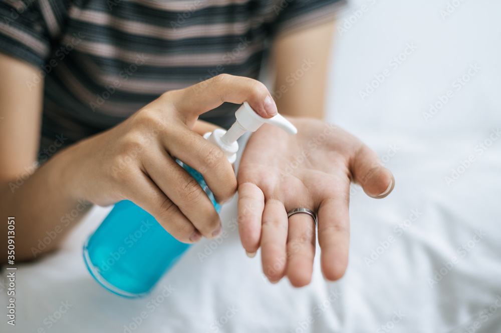 Young women wash hands with handwashing gel. Young women wash hands with handwashing gel.