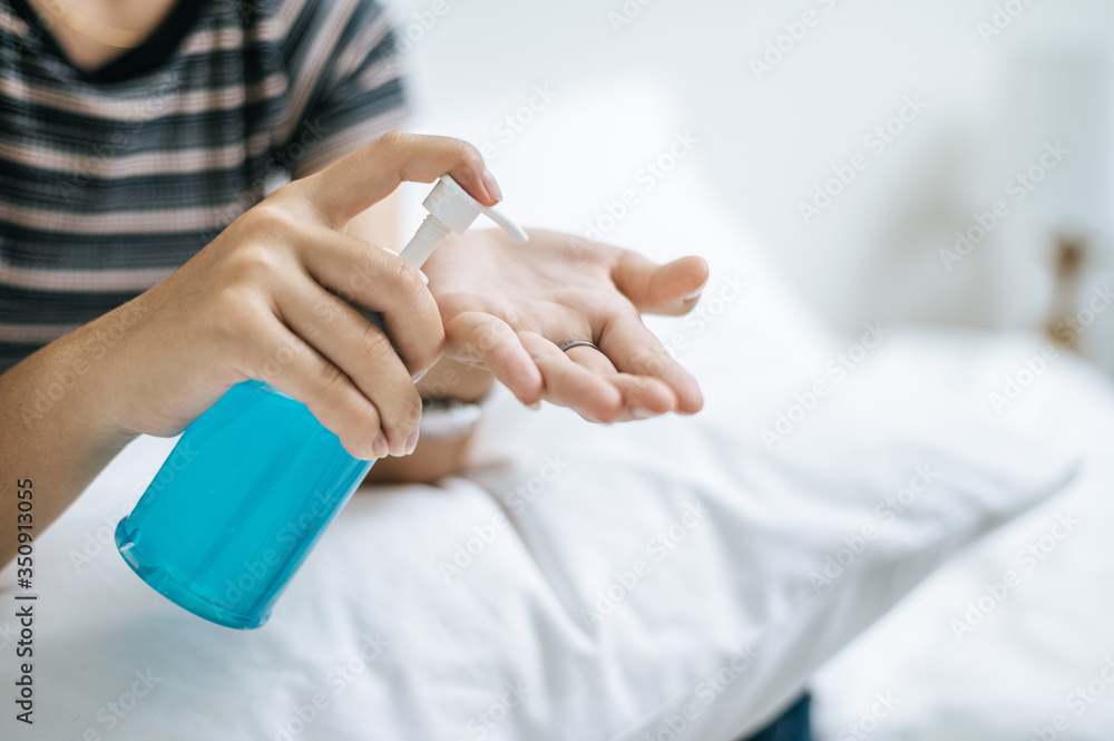Young women wash hands with handwashing gel. Young women wash hands with handwashing gel.